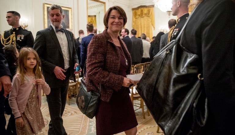 Sen. Amy Klobuchar, D-Minn., departs following a Medal of Freedom ceremony in the East Room of the White House in Washington, Friday, Nov. 16, 2018. 