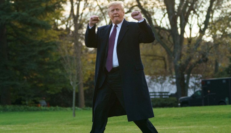 President Donald Trump gestures as he walks to Marine One after speaking to media at the White House in Washington, Tuesday, Nov. 20, 2018, for the short trip to Andrews Air Force Base en route to Palm Beach International Airport, in West Palm Beach, Fla., and on to and onto Mar-a-Lago. 