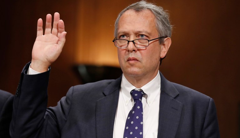 FILE - In this Sept. 20, 2017, file photo, Thomas  Farr is sworn in during a Senate Judiciary Committee hearing on his nomination to be a District Judge on the United States District Court for the Eastern District of North Carolina, on Capitol Hill in Washington.