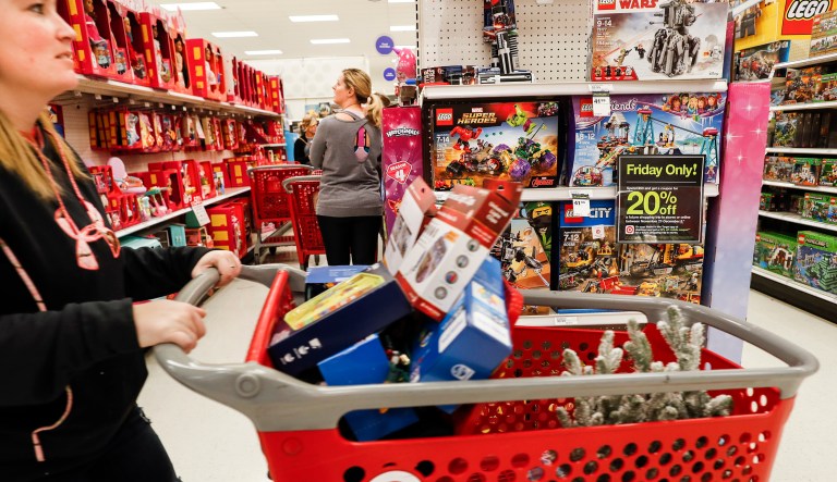 Shoppers browse the aisles during a Black Friday sale at a Target store, Friday, Nov. 23, 2018, in Newport, Ky.