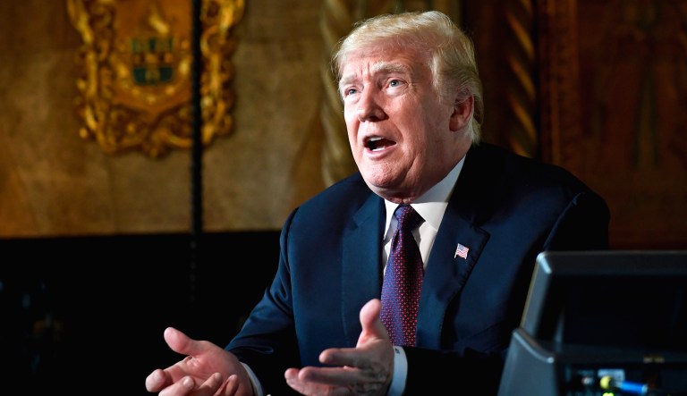 President Trump speaks with reporters at his Mar-a-Lago estate in Palm Beach, Fla.