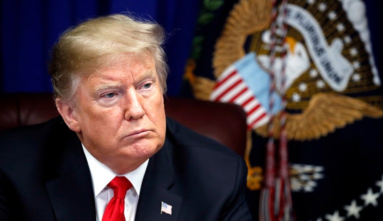President Trump listens during a roundtable discussion.