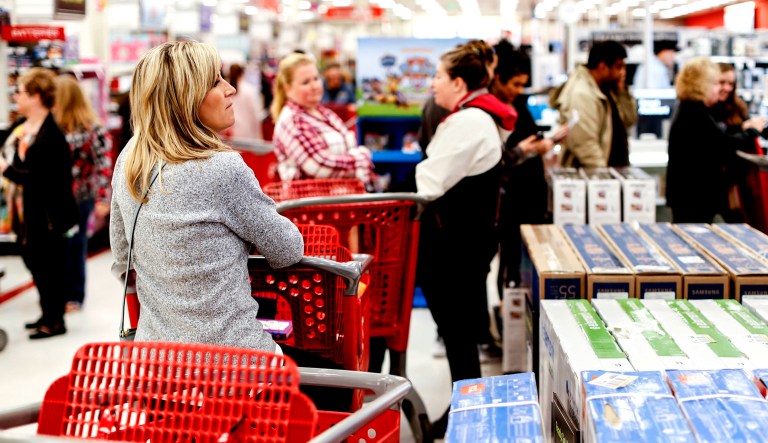 Shoppers wait in line at a store.