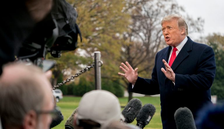In this Nov. 26, 2018, photo, President Donald Trump speaks to members of the media about plans to dismantle Obama administration efforts to rein in coal, oil and gas emissions before boarding Marine One on the South Lawn of the White House in Washington.