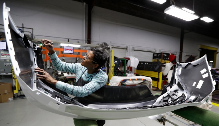Final inspector Mary Skinner inspects the rear end of a General Motors Chevrolet Cruze at Jamestown Industries, Wednesday, Nov. 28, 2018, in Youngstown, Ohio. Jamestown Industries supplies parts for the Chevy Cruze. GM said Monday that Lordstown will stop making the Chevy Cruze by March, at a cost of 1,400 union jobs on top of the 2,700 lost there since President Trump took office.