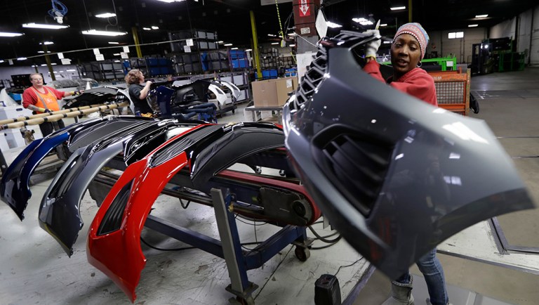 Mari Keels transfers a front end of a General Motors Chevrolet Cruze during assembly at Jamestown Industries.