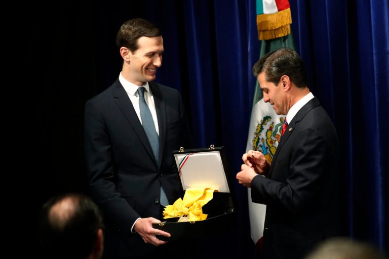 Mexican President Enrique Pena Neto, right, awards White House Senior Adviser Jared Kushner with The Order of the Aztec Eagle, the highest Mexican order awarded to foreigners, Friday, Nov. 30, 2018 in Buenos Aires, Argentina.