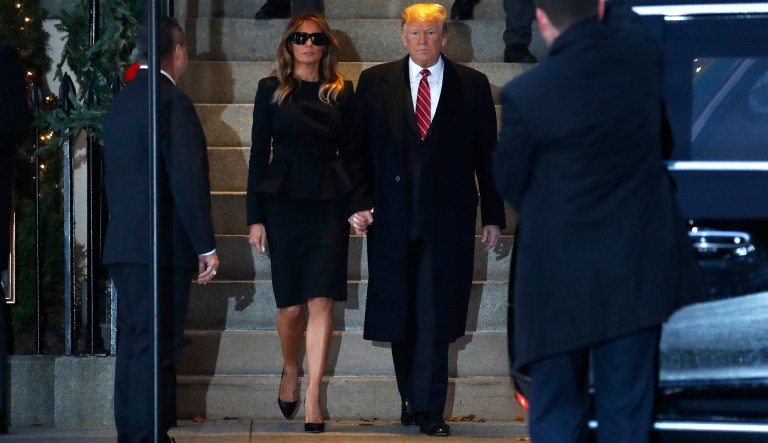 President Donald Trump and first lady Melania Trump hold hands as they leave Blair House after visiting with the family of former President George H. W. Bush, Tuesday, Dec. 4, 2018, in Washington.