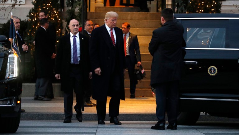 President Trump walks to the vehicle as they leave Blair House after visiting with the family of former President George H. W. Bush.