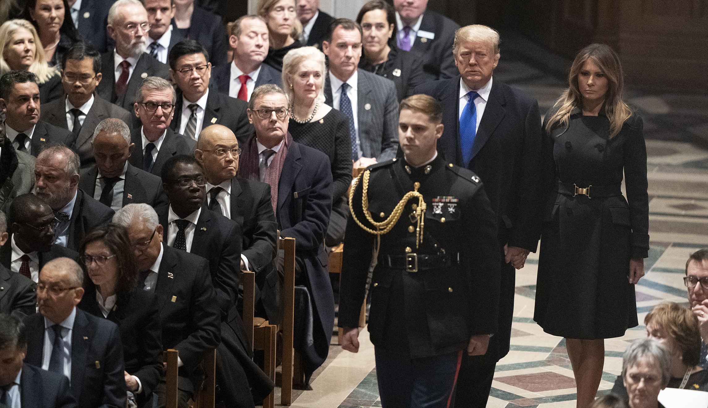 Trumps sit next to Obamas at George H.W. Bush’s funeral