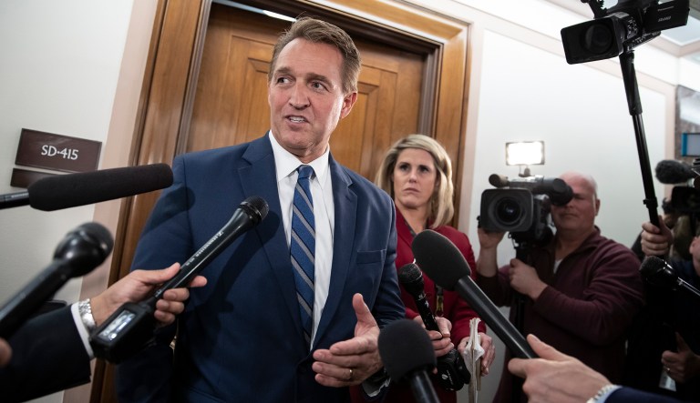 Sen. Jeff Flake, R-Ariz., a member of the Senate Foreign Relations Committee, speaks with reporters as senators are considering multiple pieces of legislation in an effort to formally rebuke Saudi Arabia for the slaying of journalist Jamal Khashoggi, on Capitol Hill in Washington, Thursday, Dec. 6, 2018.