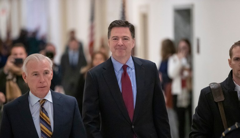 Former FBI Director James Comey, with his attorney, David Kelley, left, arrive to testify under subpoena behind closed doors before the House Judiciary and Oversight Committee on Capitol Hill in Washington, Friday, Dec. 7, 2018.