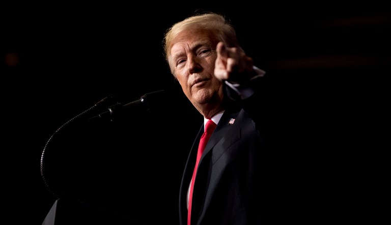 President Trump points at a member of the audience while speaking the 2018 Project Safe Neighborhoods National Conference at the Westin Kansas City at Crown Center in Kansas City, Mo., Friday, Dec. 7, 2018.