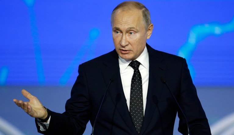 Russian President Vladimir Putin addresses the audience at the United Russia party congress in Moscow, Russia, Saturday, Dec. 8, 2018.