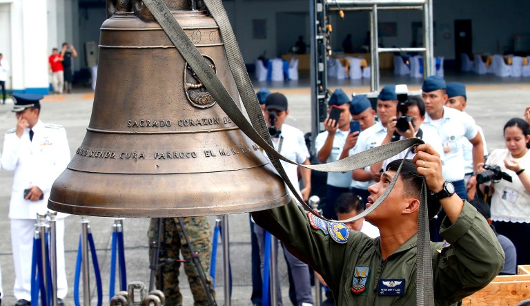In this Tuesday, Dec. 11, 2018, file photo, Philippine Air Force personnel unload three church bells seized by American troops as war trophies more than a century ago, as they arrive in suburban Pasay city, southeast of Manila, Philippines.
