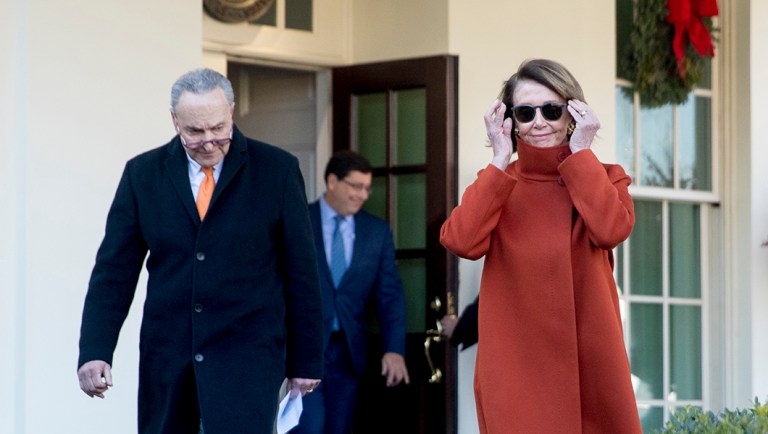 House Minority Leader Nancy Pelosi of California walks out of the West Wing to speak to members of the media outside of the White House in Washington, Tuesday, Dec. 11, 2018, following a meeting with President Trump.