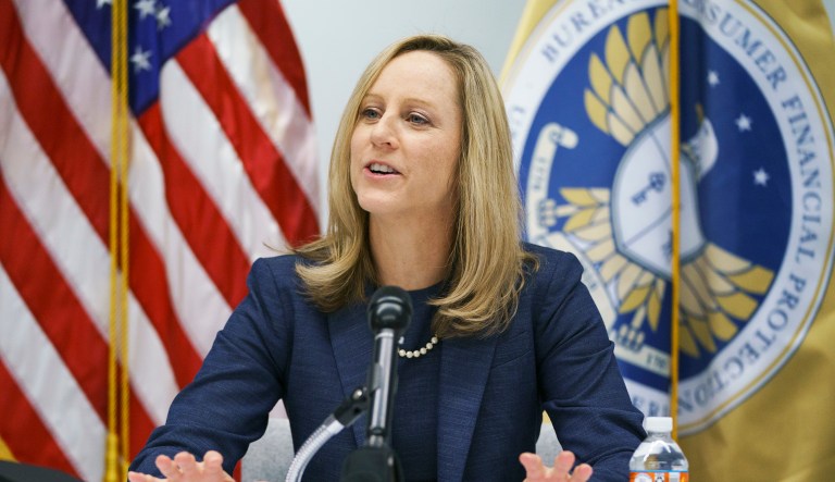 New Bureau of Consumer Financial Protection Director Kathy Kraninger speaks to media at the Bureau of Consumer Financial Protection offices in Washington, Tuesday, Dec. 11, 2018. 