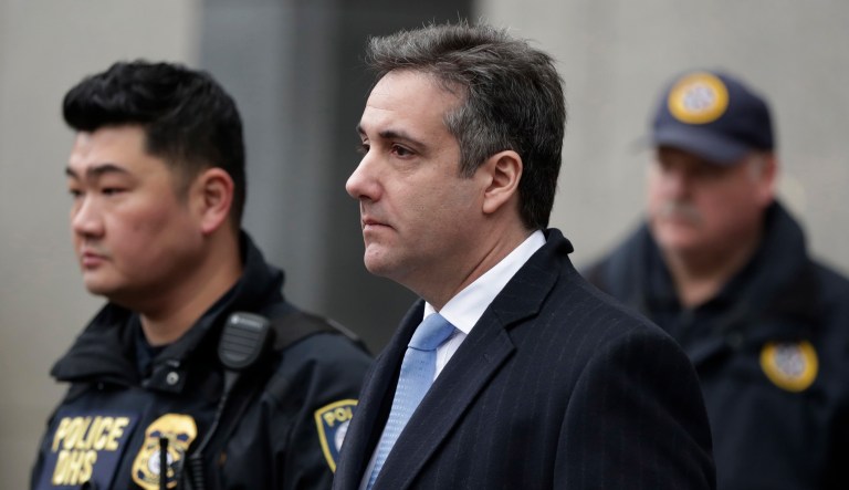 Michael Cohen, President Trump's former lawyer, leaves federal court after his sentencing in New York, Wednesday, Dec. 12, 2018. Cohen was sentenced Wednesday to three years in prison for an array of crimes that included arranging the payment of hush money to two women that he says was done at the direction of Trump.