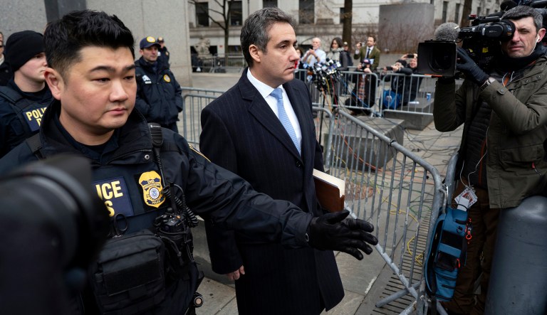 Michael Cohen, President Donald Trump's former lawyer, leaves federal court after his sentencing in New York, Wednesday, Dec. 12, 2018. Cohen was sentenced Wednesday to three years in prison for an array of crimes that included arranging the payment of hush money to two women that he says was done at the direction of Trump.