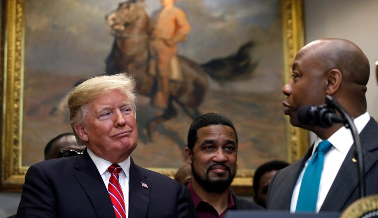 President Trump looks to Sen. Tim Scott, R-S.C., as he attends a ceremony to sign an executive order establishing the White House Opportunity and Revitalization Council, in the Roosevelt Room of the White House, Wednesday Dec. 12, 2018, in Washington.