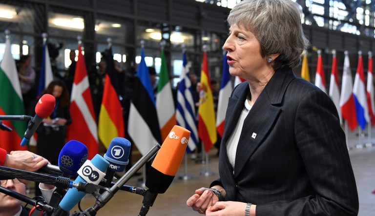 British Prime Minister Theresa May speaks with the media as she arrives for an EU summit in Brussels, Thursday, Dec. 13, 2018. EU leaders gather for a two-day summit, beginning Thursday, which will center on the Brexit negotiations.