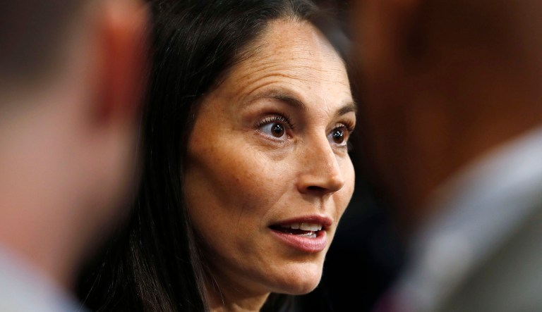 Sue Bird speaks at an event.