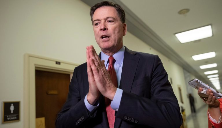 Former FBI Director James Comey speaks to reporters on Capitol Hill Washington, Monday, Dec. 17, 2018.