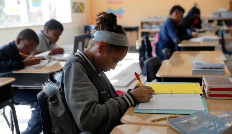 Breanna Johnson works on her assignment in her 6th grade English class at Alice M. Harte Charter School in New Orleans.