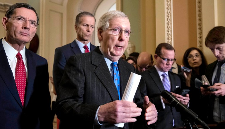 Senate Majority Leader Mitch McConnell, R-Ky., center, joined from left by Sen. John Barrasso, R-Wyo., and Sen. John Thune, R-S.D., speaks to reporters at the Capitol in D.C.