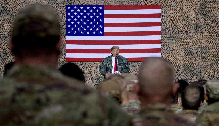 President Trump speaks at a hanger rally at al-Asad Air Base, Iraq, Wednesday, Dec. 26, 2018. In a surprise trip to Iraq, Trump on Wednesday defended his decision to withdraw U.S. forces from Syria where they have been helping battle Islamic State militants.