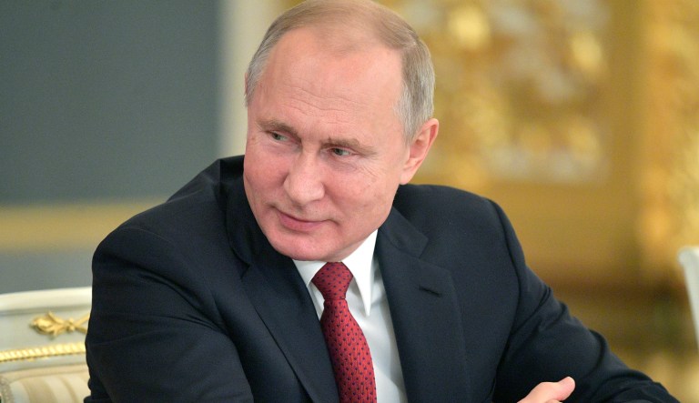 Russian President Vladimir Putin attends a State Council meeting on the development of volunteering and socially oriented NGOs, at the Moscow's Kremlin, Russia, Thursday, Dec. 27, 2018.