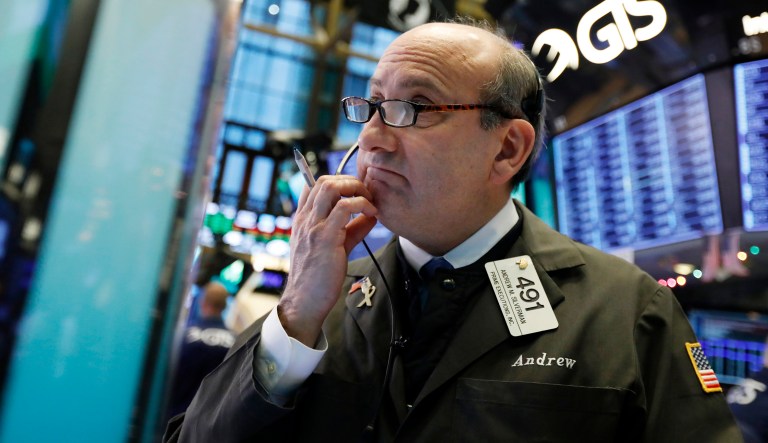 Trader Andrew Silverman works on the floor of the New York Stock Exchange, Thursday, Dec. 27, 2018. Wall Street's wild Christmas week goes on, with the Dow Jones Industrial Average slumping 300 points at the open Thursday, a day after notching its biggest-ever point gain.