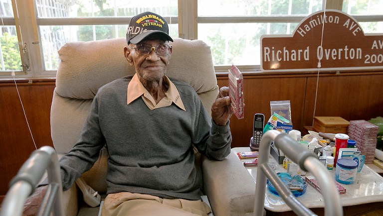 In this May 10, 2018 photo Richard Overton, the oldest living U.S. Veteran at the age of 111, is back in the east Austin home he has owned since 1948 after a renovation provided by Meals on Wheels of Central Texas and the Home Depot Foundation.