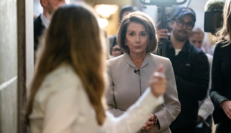 House Democratic Leader Nancy Pelosi of California, who will become speaker of the House on Jan. 3, walks to her new office at the Capitol during a television interview for the NBC Today Show with Savannah Guthrie, right, in Washington, Wednesday, Jan. 2, 2019.