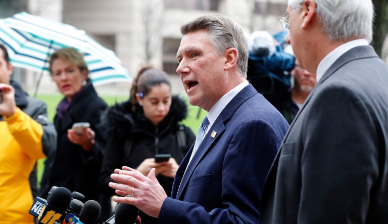 Mark Harris, center, Republican candidate for North Carolinaâs 9th Congressional District seat, speaks with reporters alongside his attorney David Freedman, right, outside the state elections board building in Raleigh, N.C.