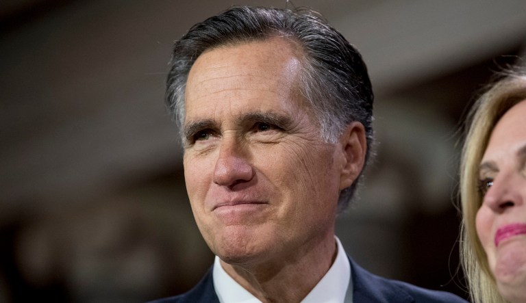 Sen. Mitt Romney, R-Utah, smiles during a mock swearing in ceremony in the Old Senate Chamber on Capitol Hill in Washington, Thursday, Jan. 3, 2019, as the 116th Congress begins.