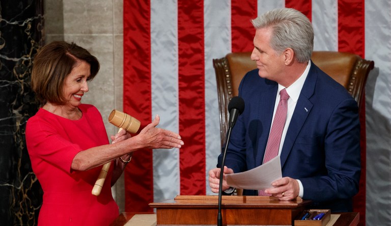 Newly elected House Speaker Nancy Pelosi of California, who will lead the 116th Congress, holds out her hand to Rep. Kevin McCarthy, R-Calif., after he gave her the gavel at the U.S. Capitol in Washington, D.C.