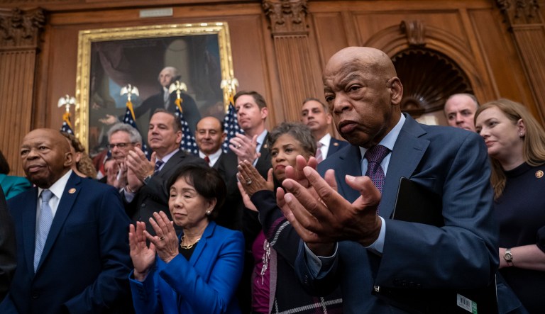 From left, Rep. Elijah Cummings, D-Md., chairman of the House Committee on Oversight and Reform, Rep. Doris Matsui, D-Calif., and Rep. John Lewis, D-Ga., applaud as House Democrats unveil a comprehensive elections and ethics reform package that targets what they call a "culture of corruption in Washington," at the Capitol in Washington, Friday, Jan. 4, 2019.