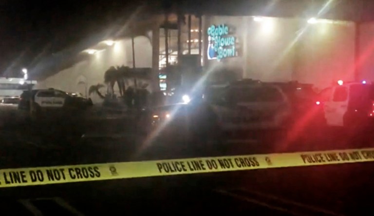 Police rope off the scene of a shooting at a bowling alley in Torrance, Calif., early Saturday, Jan. 5, 2019.