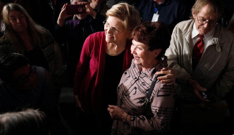 Sen. Elizabeth Warren, D-Mass., left, poses for photos after an organizing event at Curate event space in Des Moines, Iowa, on Saturday, Jan. 5, 2019. 