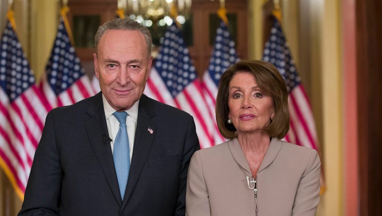 Senate Minority Leader Chuck Schumer of N.Y., and House Speaker Nancy Pelosi of Calif., pose for photographers.