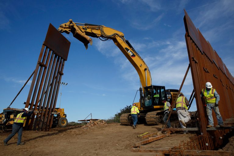 Construction crews install new border wall sections Wednesday, Jan. 9, 2019, seen from Tijuana, Mexico. A new Pew survey of international data finds that most Hispanic migrants over time have chosen the U.S.