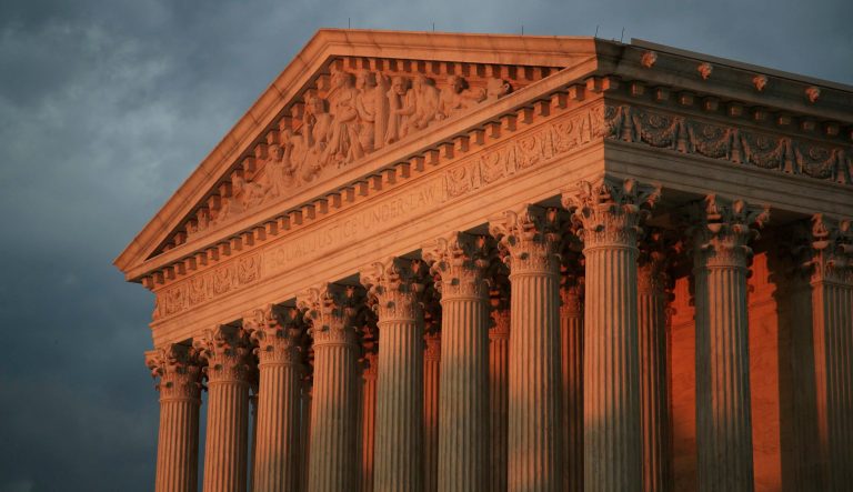 In this Oct. 4, 2018 photo, the U.S. Supreme Court is seen at sunset in Washington. The Supreme Court will decide whether the main federal civil rights law that prohibits employment discrimination applies to LGBT people. 
