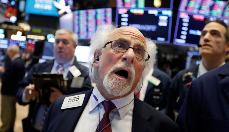 Trader Peter Tuchman works on the floor of the New York Stock Exchange, Monday, Jan. 14, 2019. Stocks are opening lower on Wall Street after China reported a surprise drop in exports to the U.S. last month.
