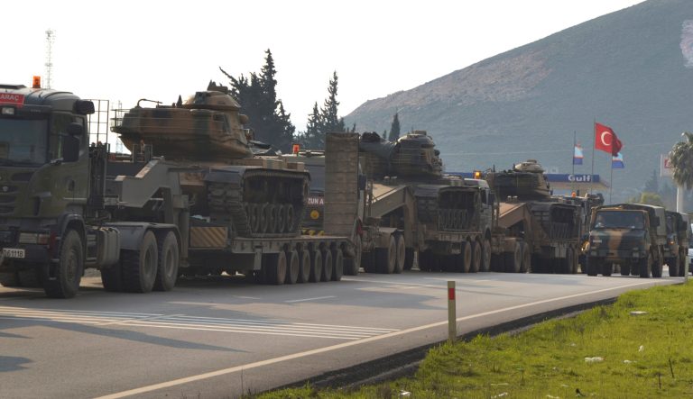 A convoy of Turkish military trucks carrying tanks and armoured personnel carriers destined for Syria in preparation for a possible military offensive, moves in Hatay province, southeastern Turkey, near the border with Syria, Monday, Jan. 14, 2019. 