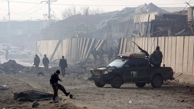 Afghan security forces gather at the site a day after an attack in Kabul, Afghanistan.