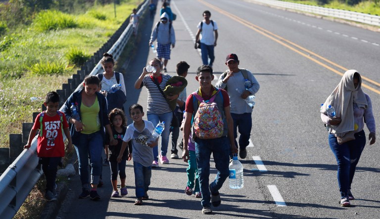 Honduras migrants, part of the caravan hoping to reach the U.S. border, walk on a road in Tapachula, Chiapas State, Mexico, Friday, Jan. 18, 2019. Hundreds of Central American migrants are walking and hitchhiking through the region as part of a new caravan of migrants hoping to reach the United States. 