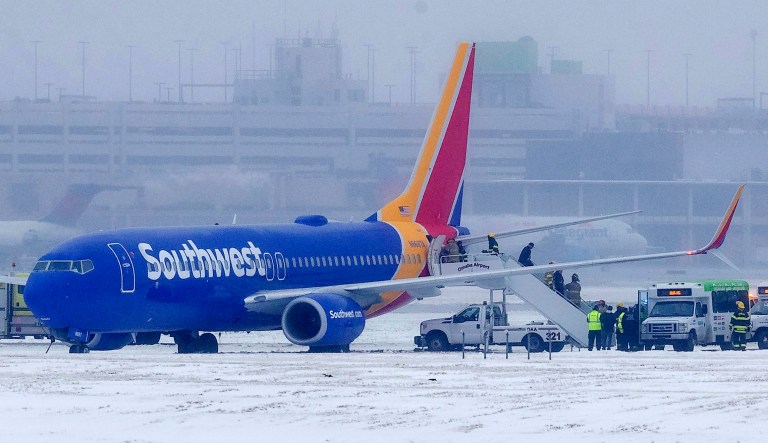 Passengers exit Southwest Airlines flight 1643 after the plane slid off the runway at Eppley Airfield Friday, Jan 18, 2019, in Omaha, Neb.