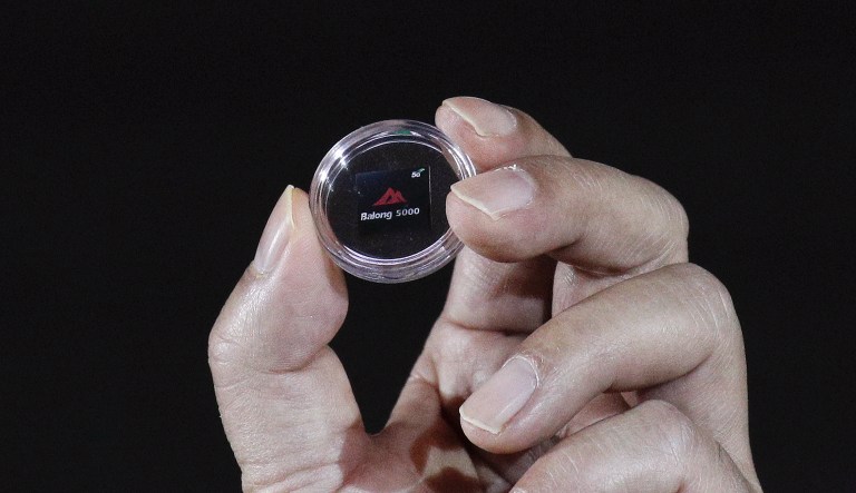 Richard Yu, CEO of Huawei Consumer Business Group, unveils the 5G modem Balong 5000 chipset in Beijing, Thursday, Jan. 24, 2019. Chinese tech giant Huawei has announced plans to release a next-generation smartphone based on its own technology instead of U.S. components, stepping up efforts to compete with global industry leaders.