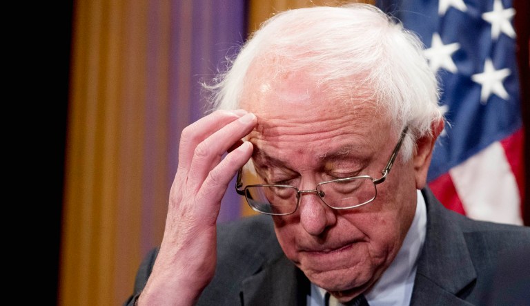 Sen. Bernie Sanders gestures during a press conference.